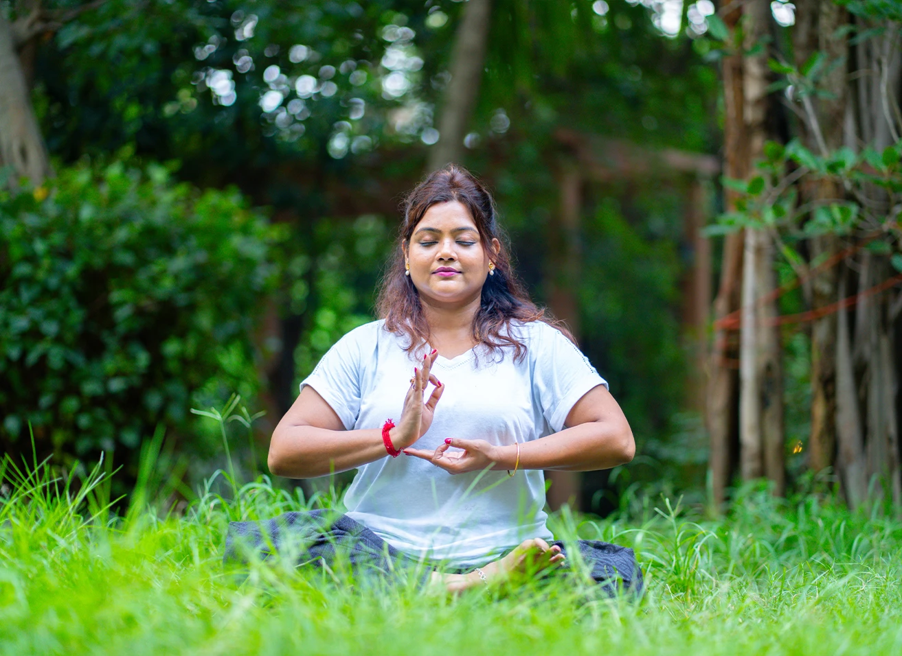 Seekers practicing Mudras for Healing hand gestures to direct life force energy at a Nabatara Institute spiritual retreat.